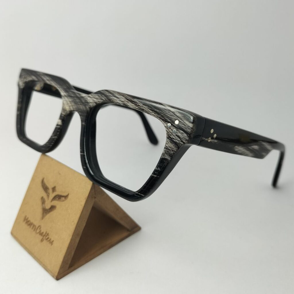 image of a close-up horn rimmed eyeglasses, highlighting its texture and natural grain