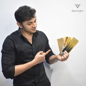 Buffalo horn plates in hands of horn crafter's team member
