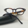 Tortoise eyeglasses kept on top of horn