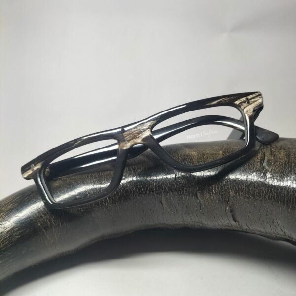 horn rimmed reading glasses kept on top of buffalo horn